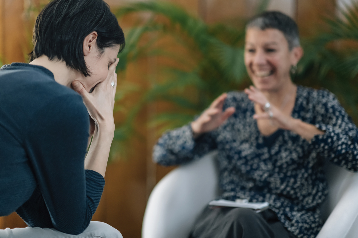 nlp or neuro linguistic programming practitioner having a conversation with a client