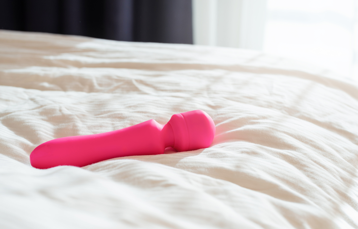 pink vibrator on the bed