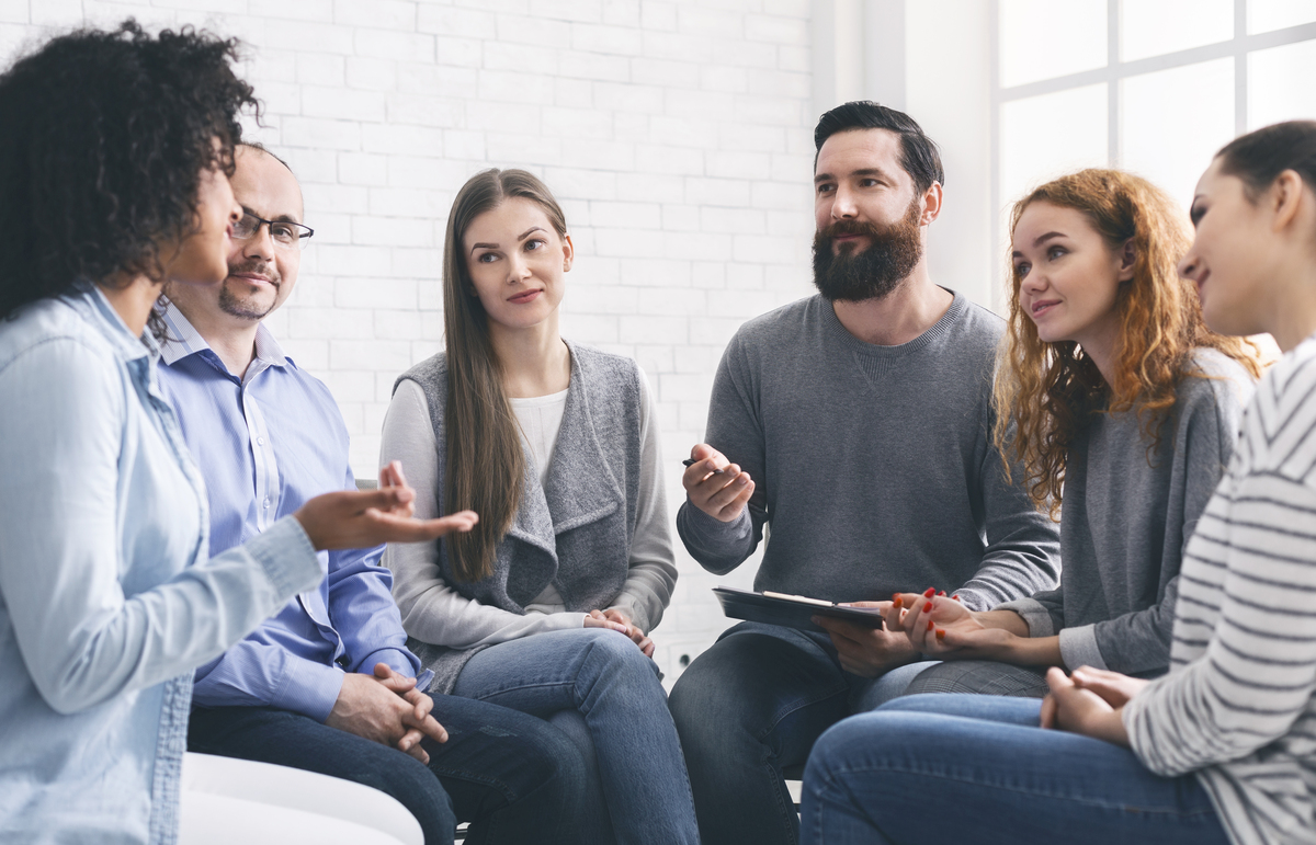 specialist giving advices to patients during group therapy