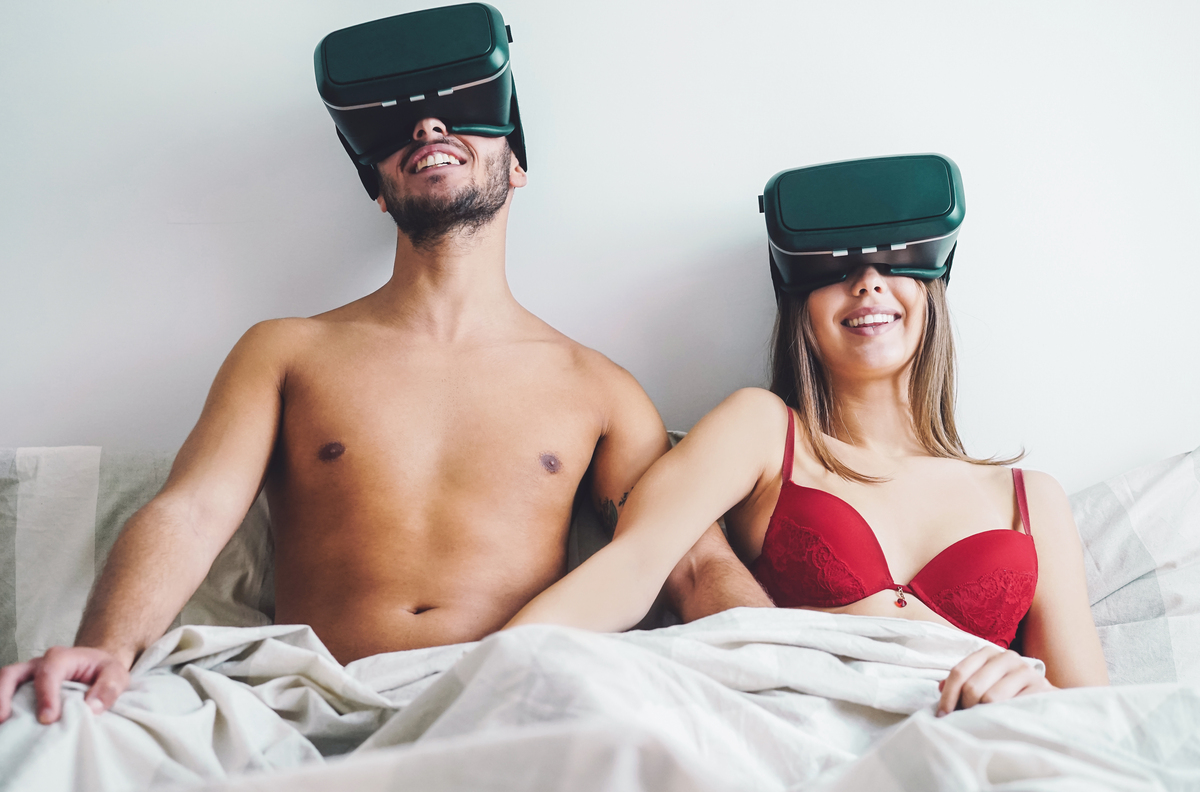 young couple masturbating while using virtual reality glasses in