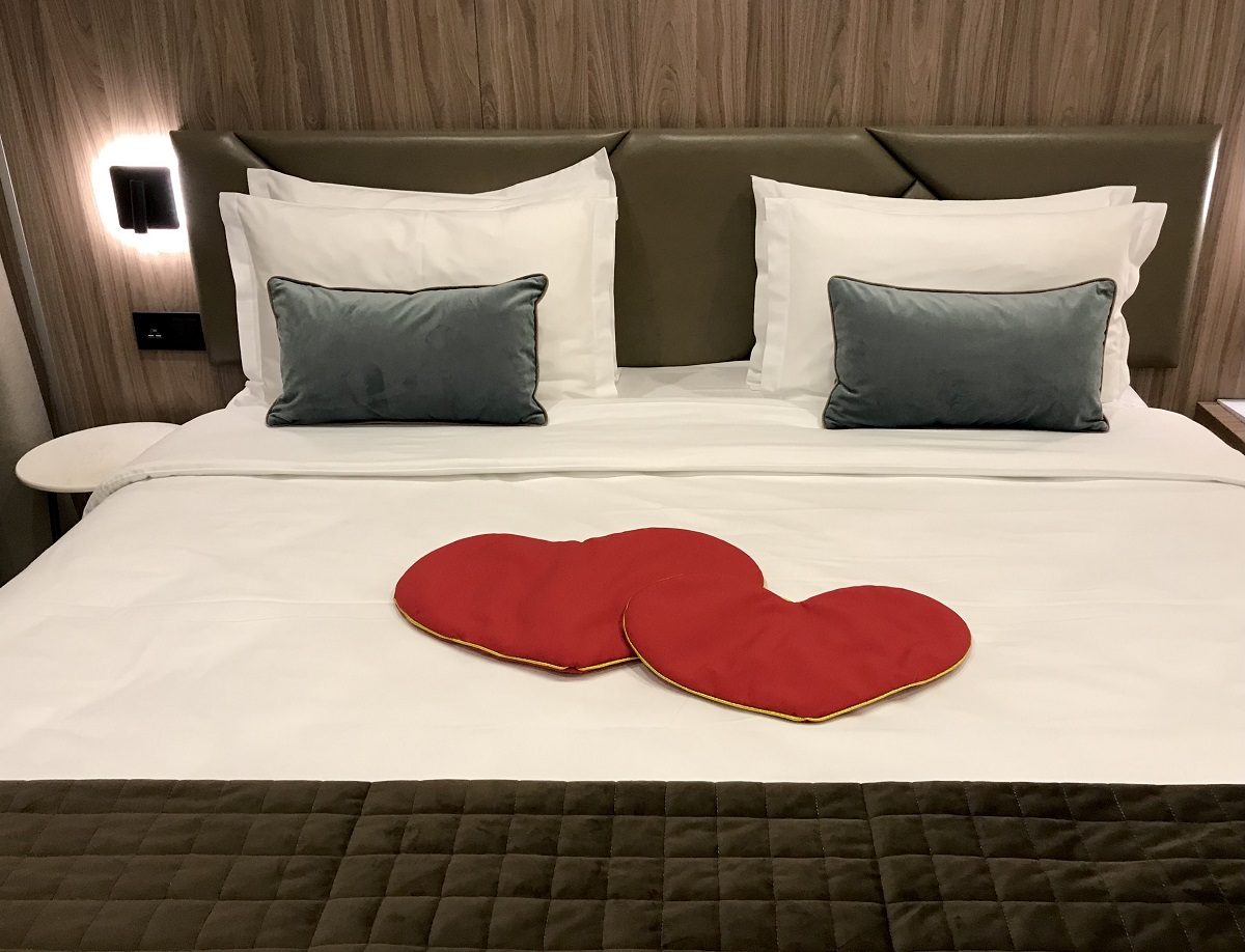 double bed in a hotel room with red hearts 2021 09 04 13 58 32 utc