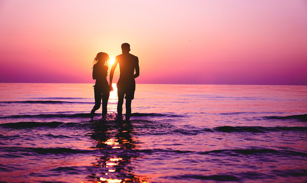 silhouette of couple in love running inside ocean 2021 09 03 12 19 25 utc(1)(1)