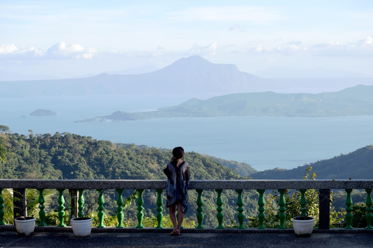 woman enjoying the view of taal volcano in the phi 2022 08 01 01 26 39 utc(1)(1)