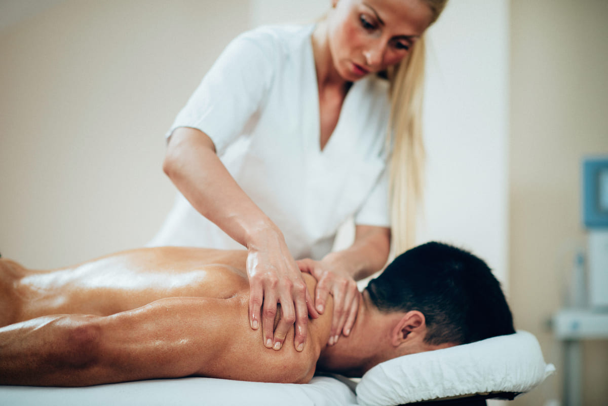 sports massage therapist doing shoulder massage 2021 08 26 16 53 24 utc(1)(1)